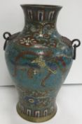 A Chinese cloisonne blue ground baluster shaped vase with central phoenix decoration within two