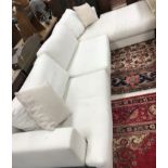 A modern cream upholstered corner sofa (maker unknown but apparently bespoke made for vendor),