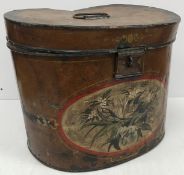 A Victorian painted oval hat tin, the front medallion decorated with spray of flowers, 41.