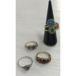 A collection of five various gold rings including a five stone graduated garnet ring, size L,