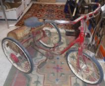 A vintage Triang trike of typical form with panier,