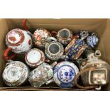 A collection of various Oriental teapots including four various Japanese Kutani style teapots,