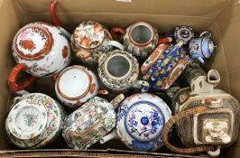 A collection of various Oriental teapots including four various Japanese Kutani style teapots,