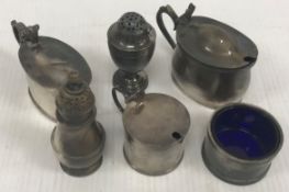 A collection of silver wares comprising two lidded mustards of plain oval form,