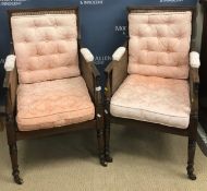 A pair of circa 1900 mahogany framed bérgère armchairs in the Georgian style,