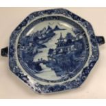A 19th Century Chinese blue and white warmer plate of octagonal form with lug handles (one for