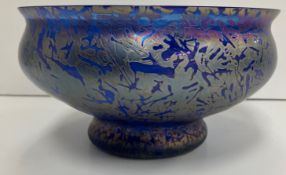 A modern studio glass bowl of blue ground with iridescent crazed decoration in the style of John