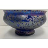 A modern studio glass bowl of blue ground with iridescent crazed decoration in the style of John