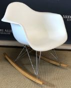 A white plastic RAR rocking armchair designed by Charles & Ray Eames for Vitra raised on chrome