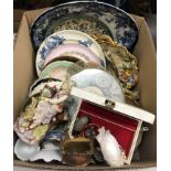 Three boxes of assorted china figurines, decorative plates,