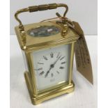 A French lacquered brass cased carriage clock,