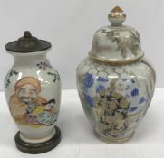 A Japanese Meiji Period Satsuma ware vase decorated with figures in an interior,