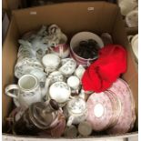 A box of assorted china wares to include a Crown Stafford floral decorated part coffee service,