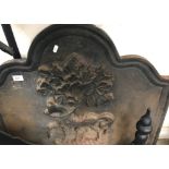 A wrought iron cast iron fire back decorated with horse and tree, 75 cm wide x 66 cm high,