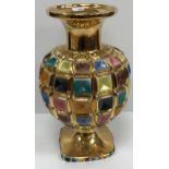 A 1960s Italian polychrome and gilt decorated vase of multi-panelled form, raised on a square foot,