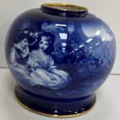 A Royal Doulton blue and white transfer decorated bulbous vase decorated with two young children in