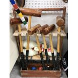 An Über Games croquet set with six mallets, six balls, hoops and stand,