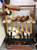 An Über Games croquet set with six mallets, six balls, hoops and stand,