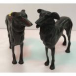 A bronze figure of a greyhound type dog 16 cm high together with another similar