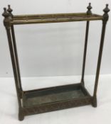 A brass twelve section umbrella stand of tubular construction,