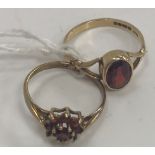 Two 9 carat gold and garnet set dress rings, size L & J,