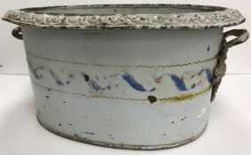 A French enamelled twin-handled jardiniere with scrolling decoration, 51 cm wide x 38.