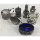 A collection of silver wares comprising pierced oval salt with bow decoration and blue glass liner,