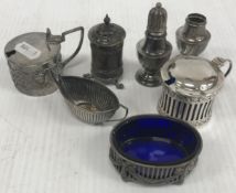A collection of silver wares comprising pierced oval salt with bow decoration and blue glass liner,