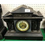 A 19th Century French black slate cased marble clock of architectural form,