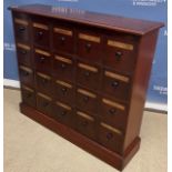 A mahogany chemist's chest, the plain top with moulded edge over a bank of twenty drawers,