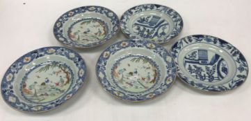 A set of three 19th Century Chinese export ware famille rose shallow bowls,