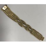 An 18-carat gold fancy chain link bracelet, 20 cm long x 2.5 cm wide, 73.