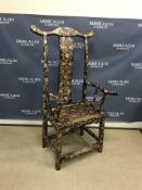 A Chinese ebonised pen work decorated scrolling floral and foliate design yoke back arm chair of