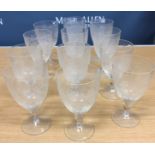 A set of twelve wine glasses with etched floral decoration