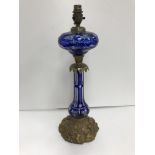 A late Victorian Bohemian blue overlaid glass and brass table oil lamp in the Rococo style,