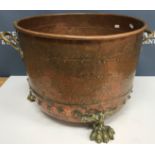 A Victorian copper copper with studded decoration converted to log container with brass handles and