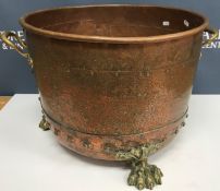 A Victorian copper copper with studded decoration converted to log container with brass handles and