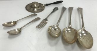A collection of various silver cutlery including three Georgian tablespoons,