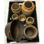 A collection of items to include a crate containing various stoneware jars, a cast iron pan,