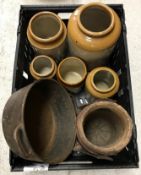 A collection of items to include a crate containing various stoneware jars, a cast iron pan,