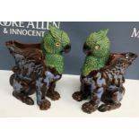 A pair of Victorian polychrome decorated and treacle-glazed gryphon vases with blue dragon