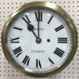 A brass ship's clock by Dent of London on mahogany mount,