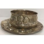 A Gorham sterling silver bowl with relief work decorated depicting the heads of children,