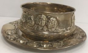 A Gorham sterling silver bowl with relief work decorated depicting the heads of children,