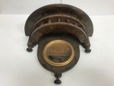 A mahogany wall shelf of demi-lune form with gilt set roundel decorated with ducks amongst