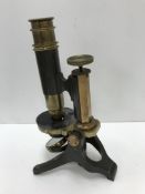 A circa 1900 anodised and brass cased minocular microscope by Heath Optician Plymouth, 24.