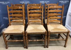 A set of six oak framed rush seat ladder back chairs in the 17th Century North Country manner,