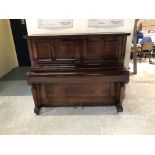 A mahogany cased upright piano, with ivory keys,