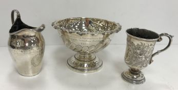 A George III silver cream jug with engraved decoration (maker's mark rubbed, London 1797),