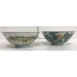 A pair of 20th Century Chinese polychrome landscape decorated bowls depicting a town scene with